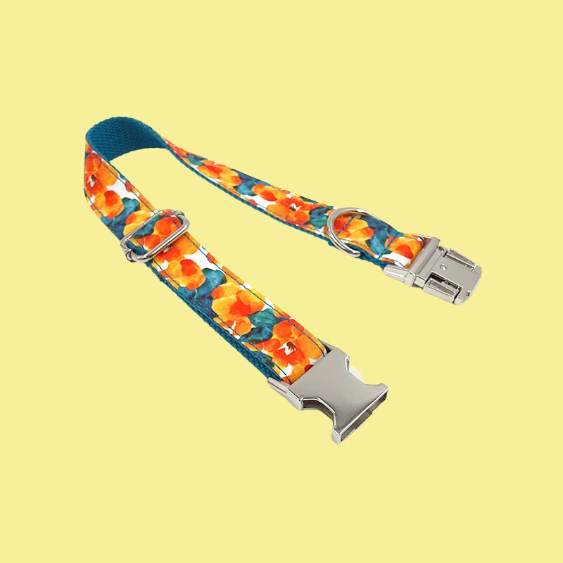 a lanyard strap with an orange flower design