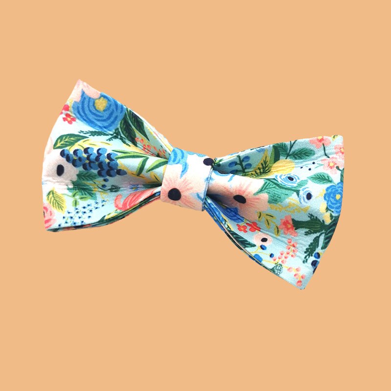 a bow tie with a flower pattern on it