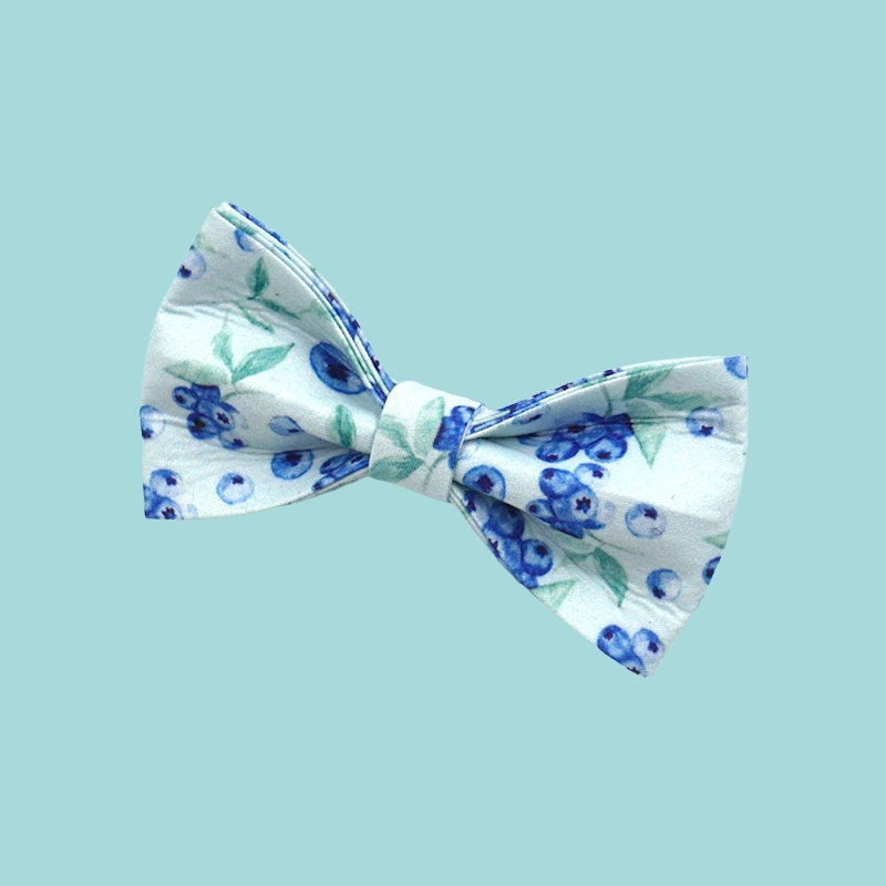 a bow tie with blue flowers on it