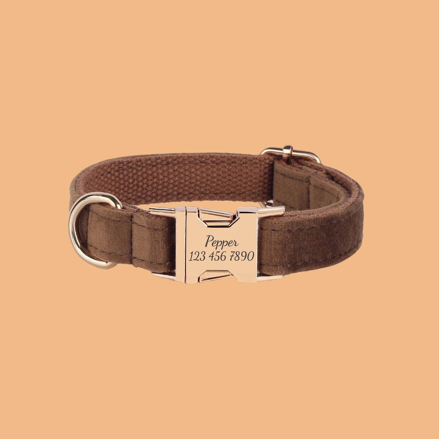 a brown dog collar with a gold buckle