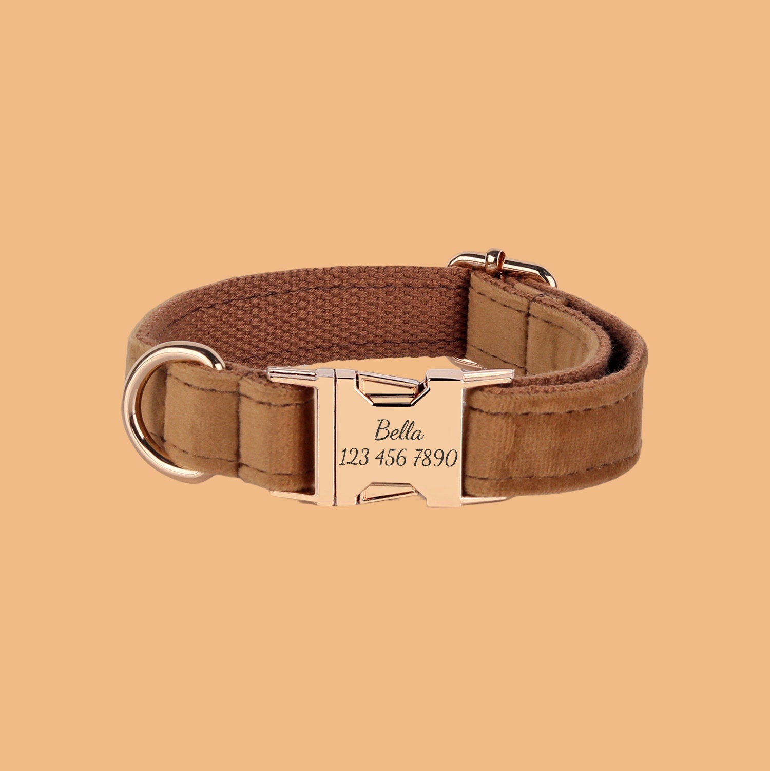 a brown dog collar with a gold buckle