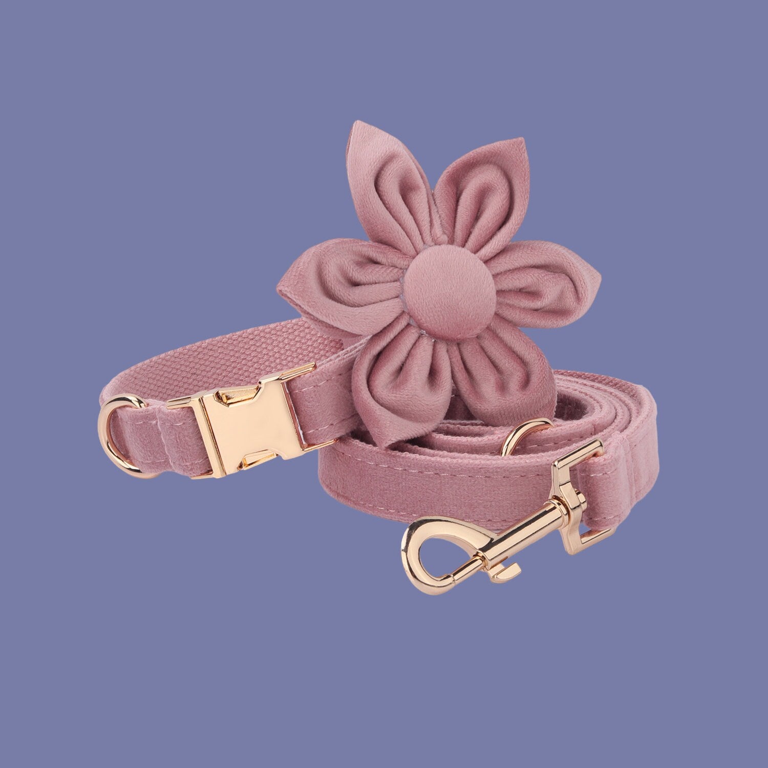 a pink dog leash with a flower on it