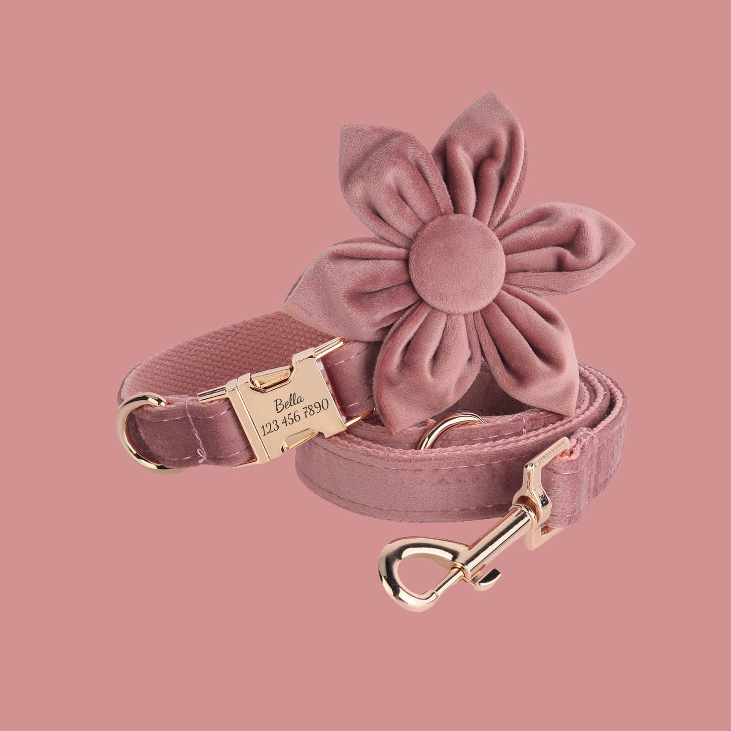 a pink dog leash with a flower on it