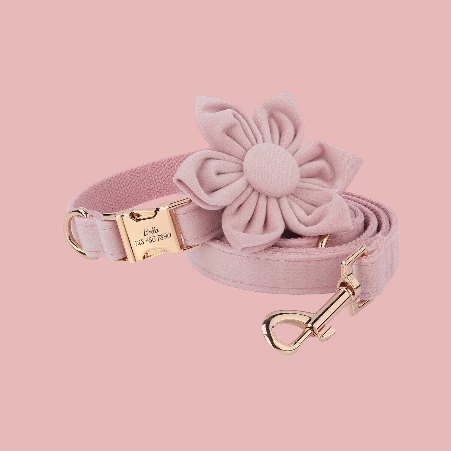 a pink dog leash with a flower on it