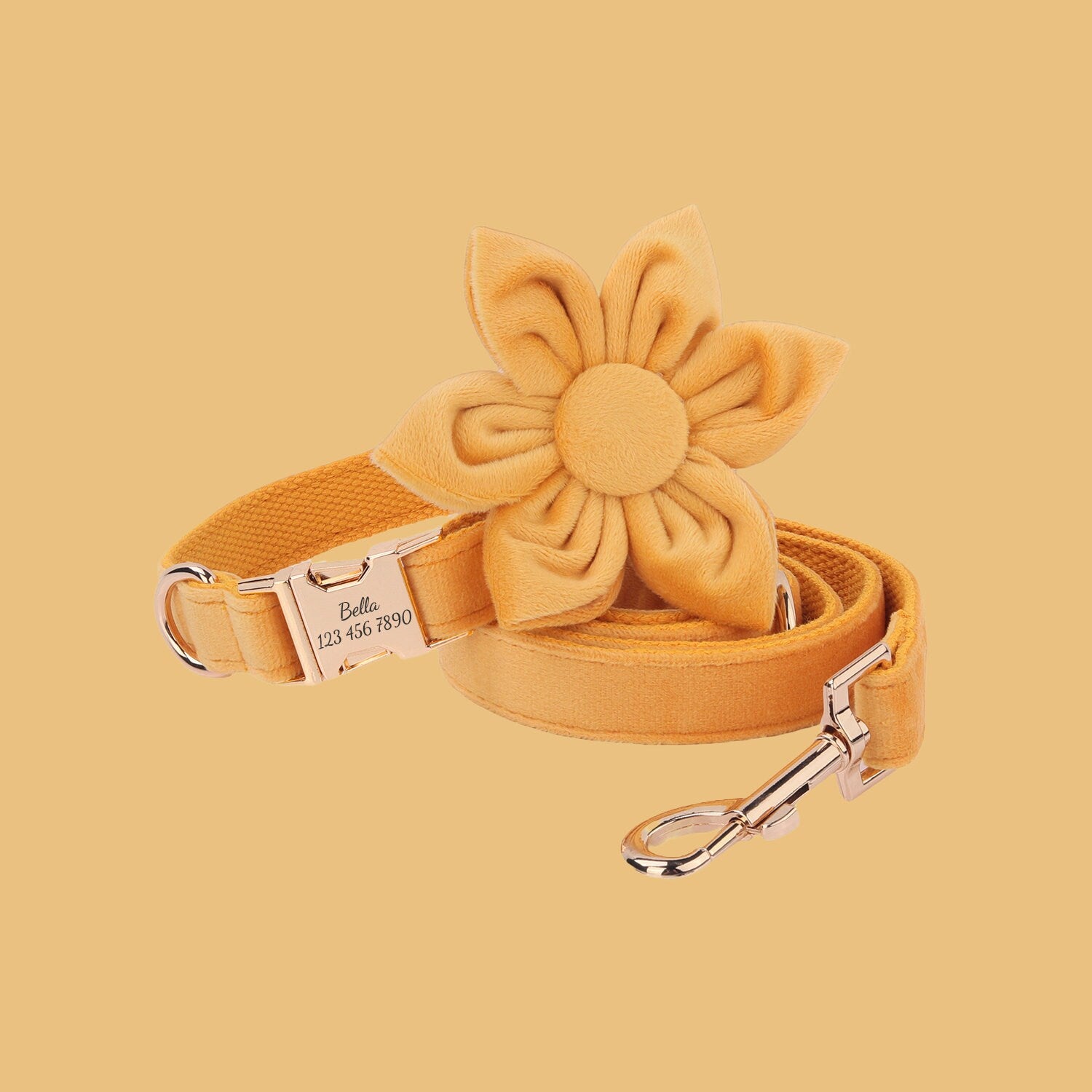 a yellow dog leash with a flower on it