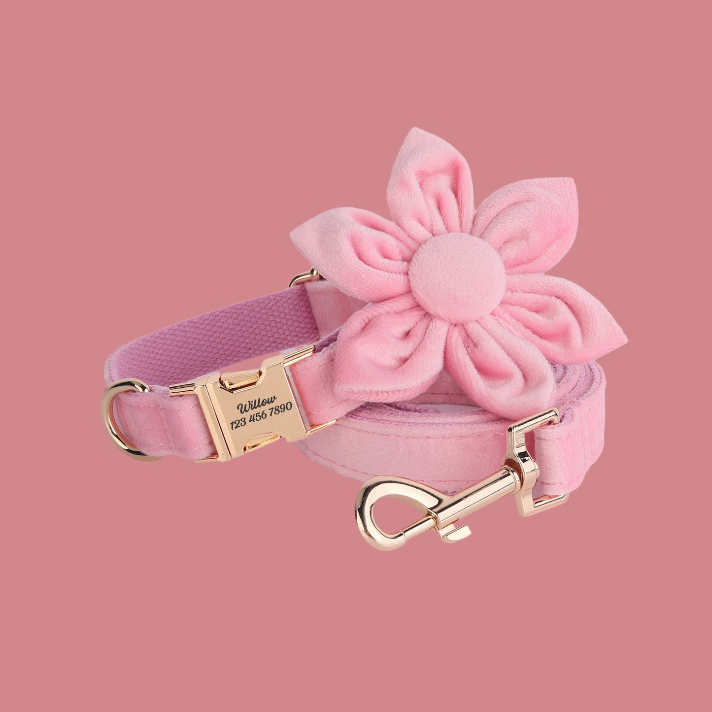 a pink dog collar with a pink flower on it