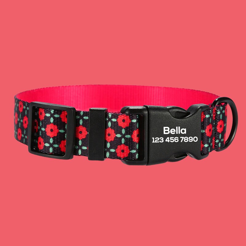 a dog collar with red flowers on a black background