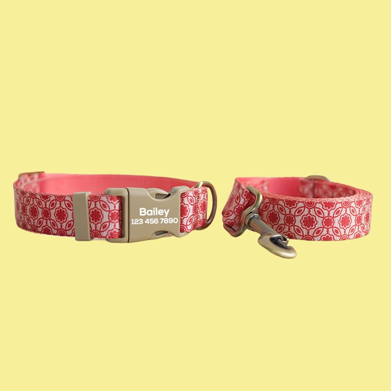 a pair of red and white dog collars on a table