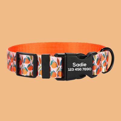 a dog collar with an orange flower design